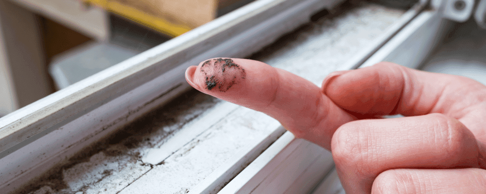 black mold on womans finger